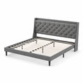 Letto matrimoniale in tessuto grigio con testiera imbottita